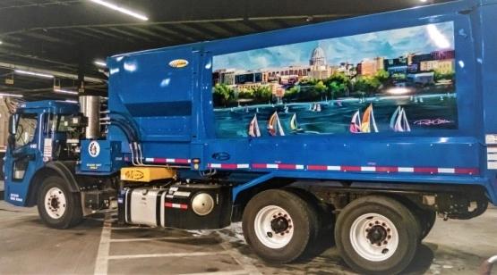 After request from toddler, Madison adds art to two garbage trucks